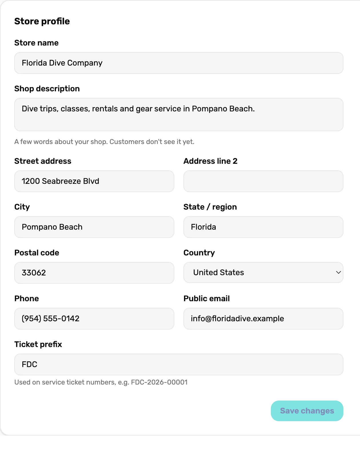 The Store profile card filled in for Florida Dive Company: a one-line description, 1200 Seabreeze Blvd, Pompano Beach, Florida, 33062, United States, phone (954) 555-0142, public email info@floridadive.example, Ticket prefix FDC, and Save changes