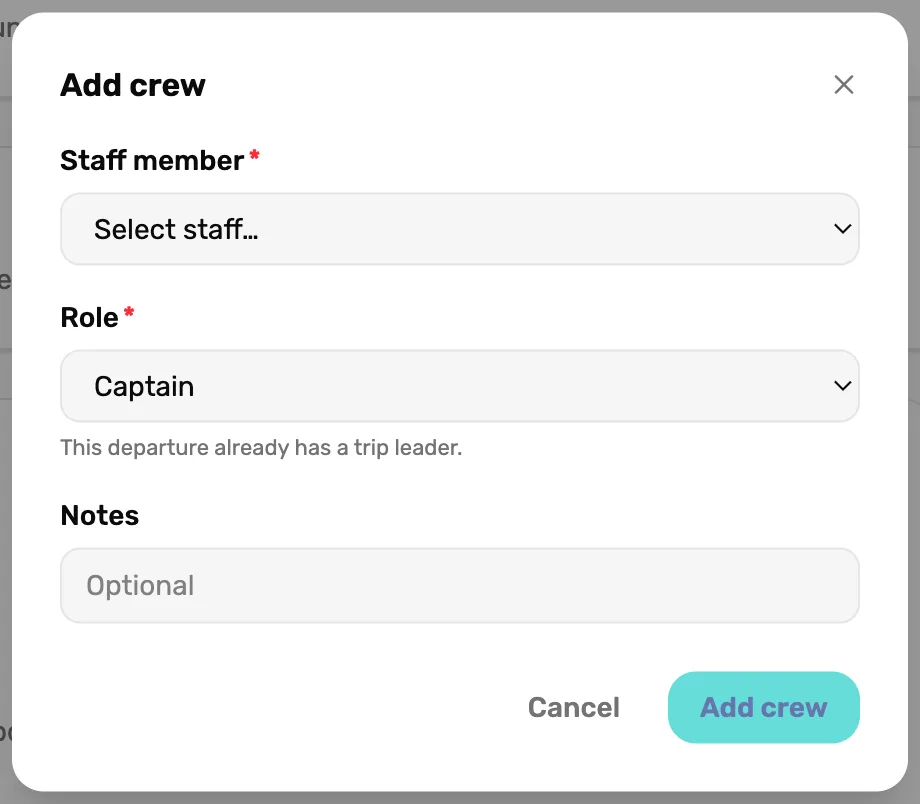 A second Add crew box on a departure that already has a leader: Staff member on Select staff…, Role on Captain with This departure already has a trip leader. under it, and Add crew greyed out