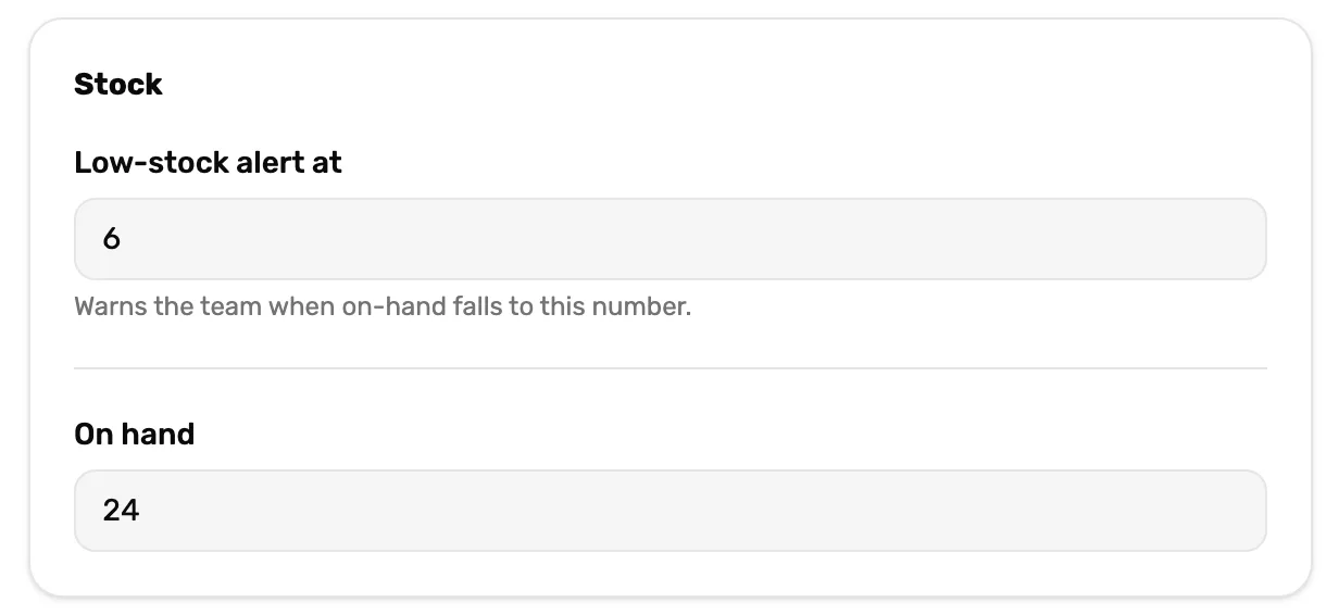 The Stock card on the register's product panel: Low-stock alert at 6, with Warns the team when on-hand falls to this number., and On hand 24 below it