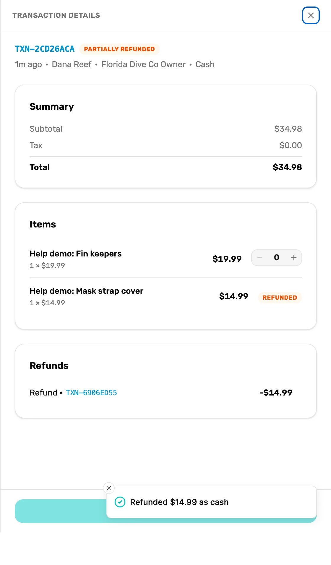 The same sale after the refund: TXN-2CD26ACA marked Partially refunded, Mask strap cover marked Refunded, a Refunds card with Refund TXN-6906ED55 at minus $14.99, and the message Refunded $14.99 as cash