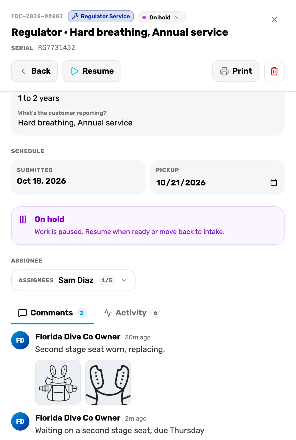 Ticket FDC-2026-00002 On hold with Back, Resume, Print and the red bin at the top, Schedule, the purple box On hold, Work is paused. Resume when ready or move back to intake., Assignees Sam Diaz, and under Comments a new comment by Florida Dive Co Owner, 2m ago: Waiting on a second stage seat, due Thursday