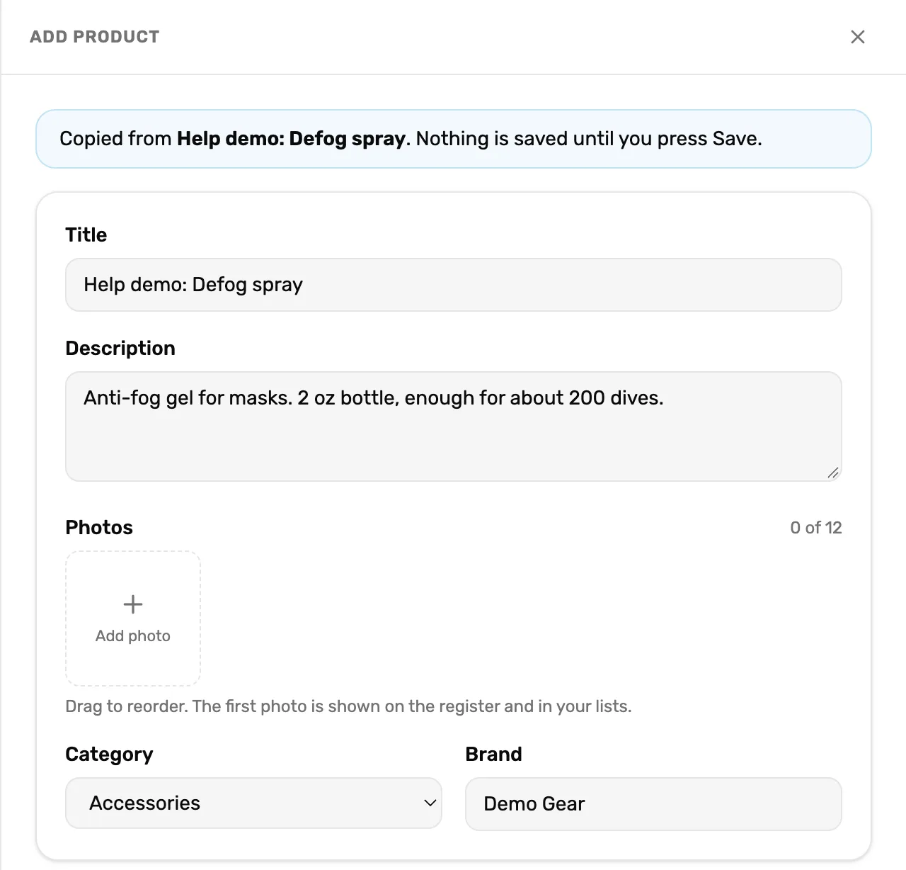 The Add product panel opened from a template: Copied from Help demo: Defog spray. Nothing is saved until you press Save. Under it the Title still reads Help demo: Defog spray, and the photos area is empty